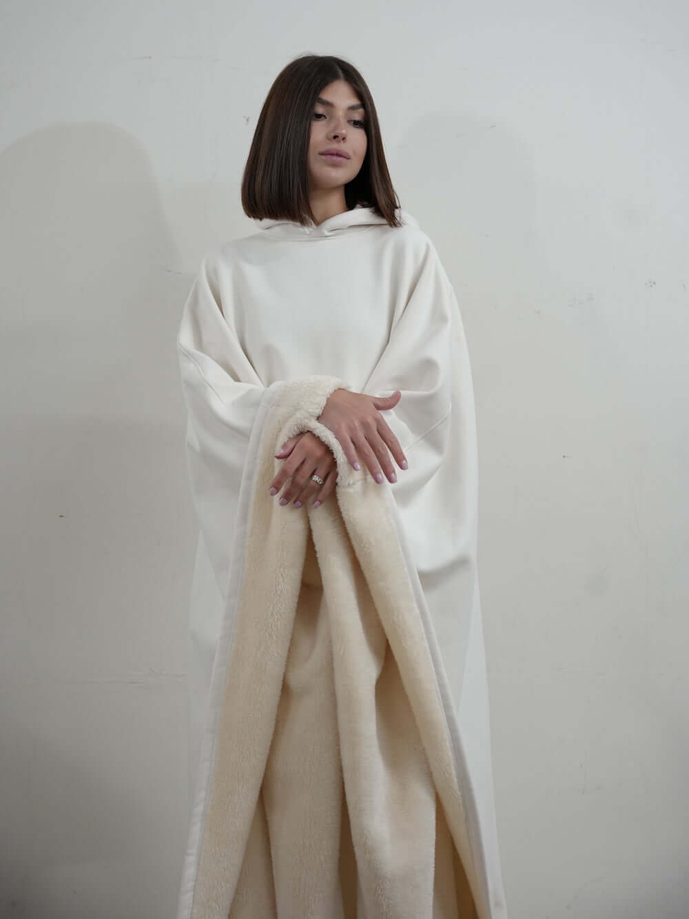 Model wearing the Eden Comfort Hoodie Blanket, showcasing its cozy design and soft fabric for ultimate relaxation.